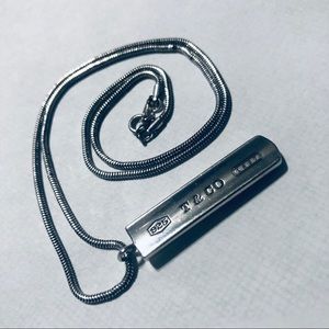 Tiffany and Co. sterling silver bar pendant.
